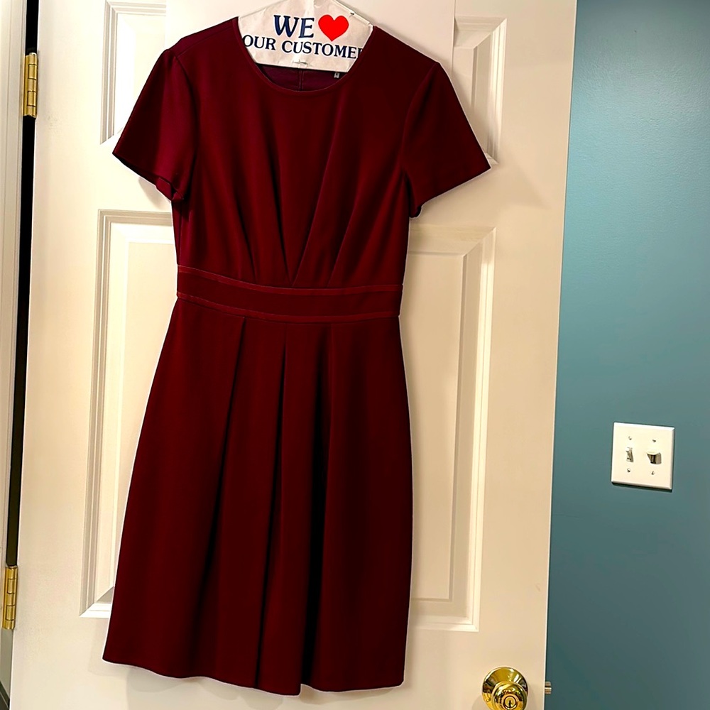 Trina Turk dress, size 6. Burgundy color. Cap sleeves and crew neck. 100% lined.
